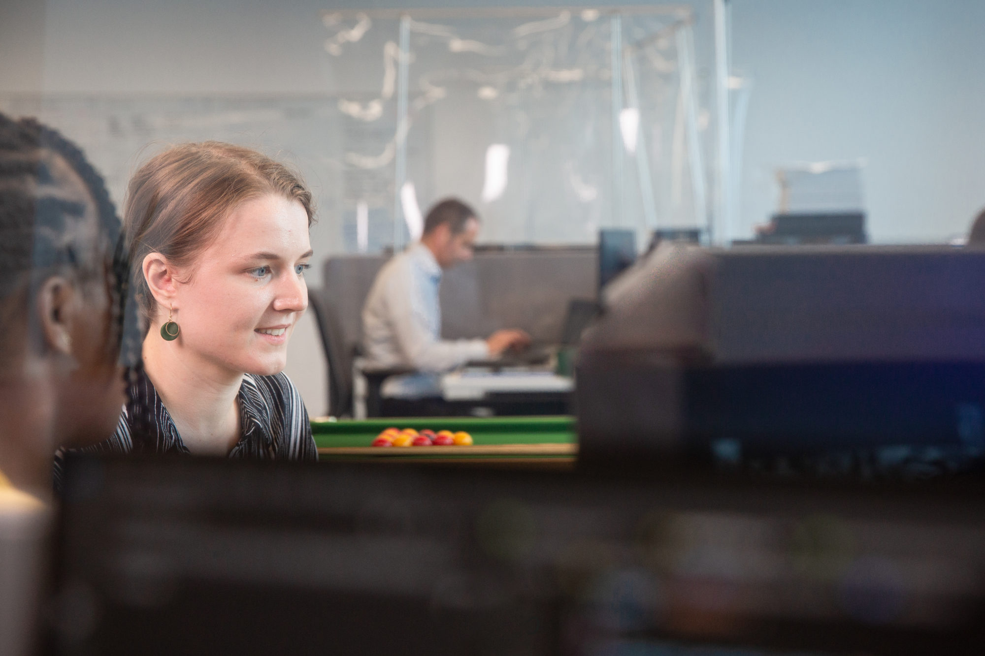 A female coder working on software development.