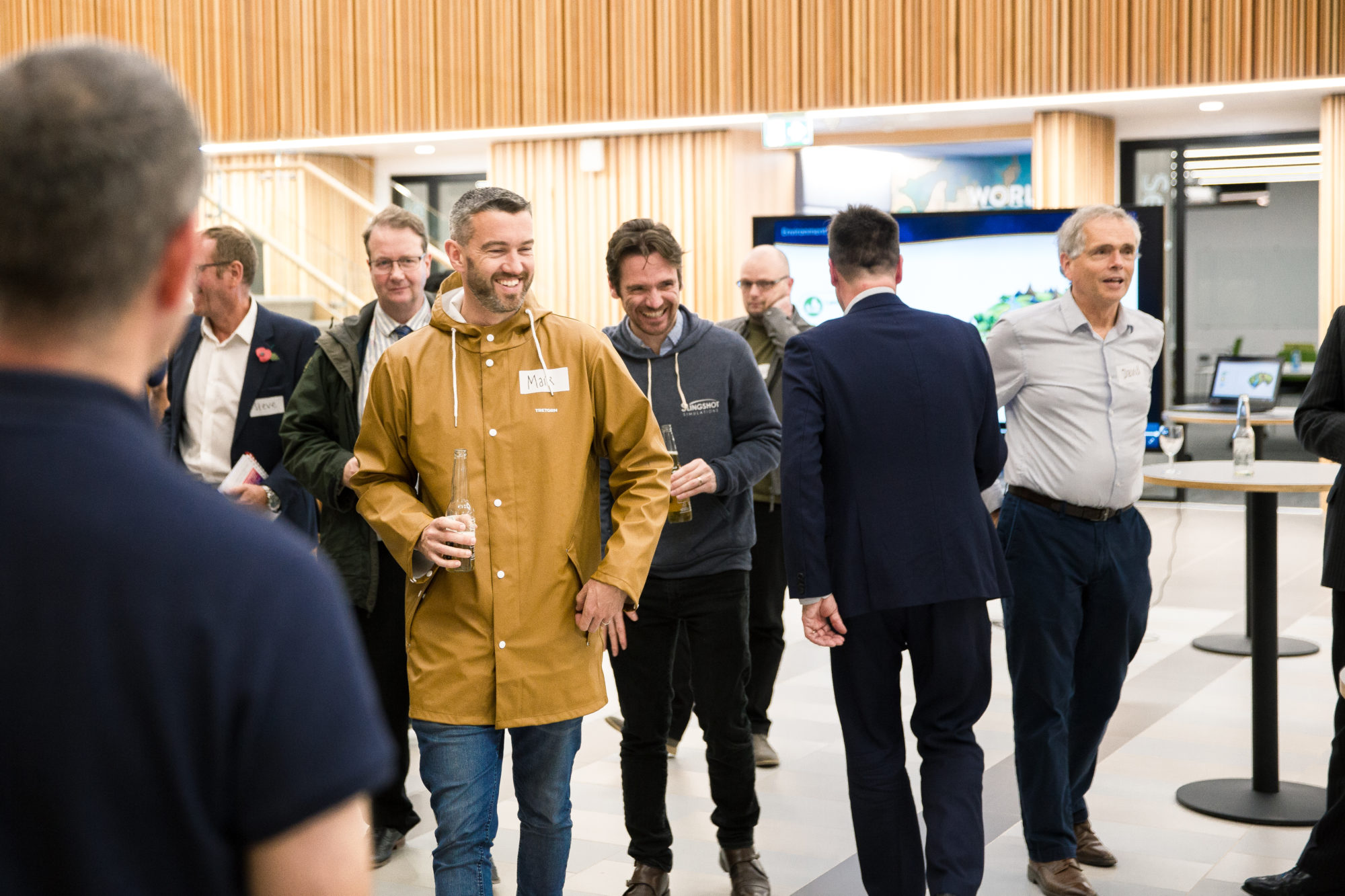 a group of Slingshot Simulations employees working at a software event
