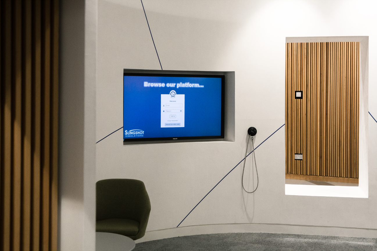A TV screen displaying the Decision Intelligence Compass: Engine Platform.