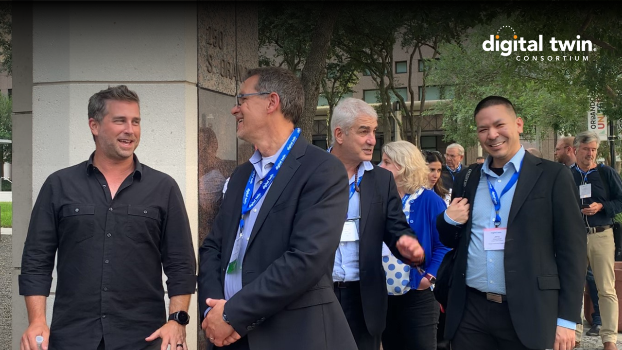 members of the digital twin consortium at an event